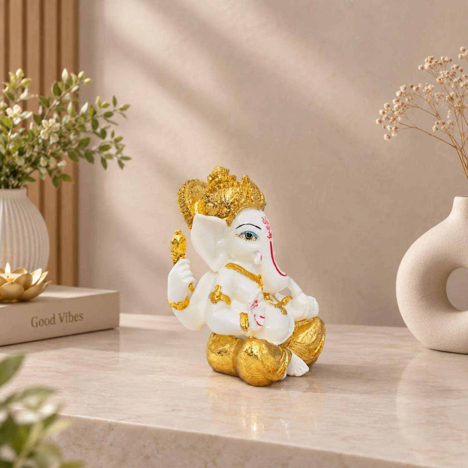 White and Gold-Tone Seated Ganesha Figurine
