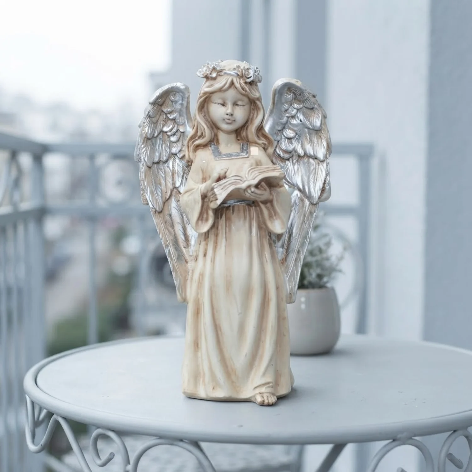 Cream and Silver-Tone Reading Angel Figurine